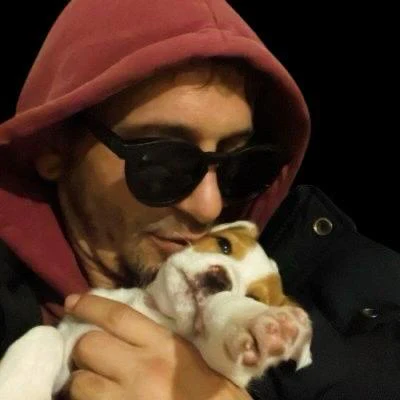 David Dacruz holding Indy, his Portuguese Podengo puppy